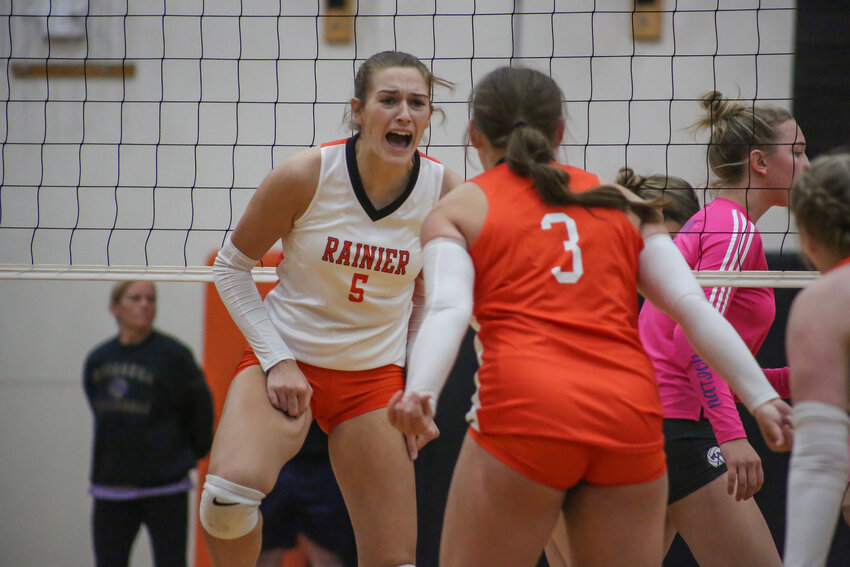 Anika Plowman, 5, celebrates with Brooklynn Swenson, 3, after Plowman makes a key block against Onalaska on Oct. 3.