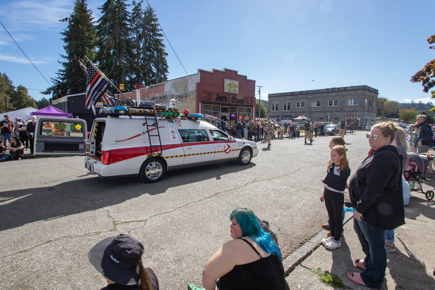 The PNW Ecto-360 Foundation's custom Ghostbusters-themed hearse rolls down North Main Street on Saturday, Oct. 5, during the Boo-coda Spook-tacular Hearse Procession.