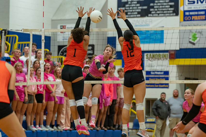 Rainier’s Acacia Murphy jumps for a block during Adna’s sweep over the Mountaineers at Adna High School on Tuesday, Oct. 8.