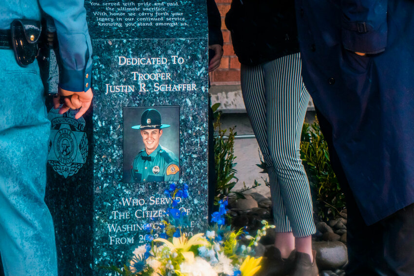 Troopers unveil a monument during a dedication ceremony on March 24, 2021, in Chehalis for Justin R. Schaffer, who was killed in the line of duty while attempting to deploy spike strips in March 2020.