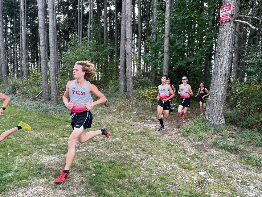 Yelm High School cross country competitors run in the Tornados' inaugural home meet on Wednesday, Oct. 9.