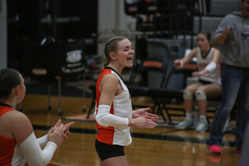 Ellie Pringle celebrates after recording the final point via ace as Rainier sweeps Toutle Lake on Oct. 15.