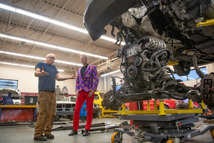 W.F. West auto shop teacher Randy Smith talks with Maximilian Macdonald, owner of Maximilian Motorsports in Chehalis, donor of many of the vehicles worked on by students in the school's shop, during a W.F. West High School Career and Technical Education Business After Hours event hosted by the Centralia-Chehalis Chamber of Commerce on Thursday, Oct. 17.