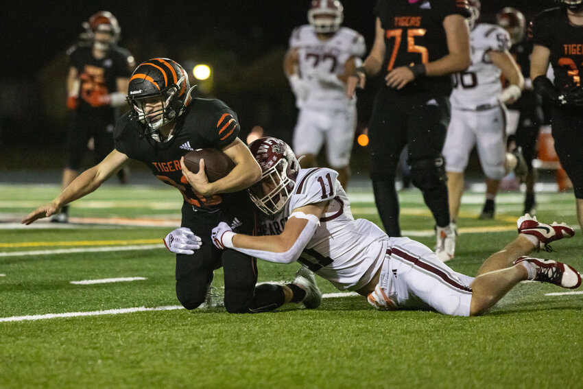 W.F. West's Grady Westlund tackles Centralia's Kellen Rooklidge during the Swamp Cup at Centralia High School on Friday, Oct. 18.