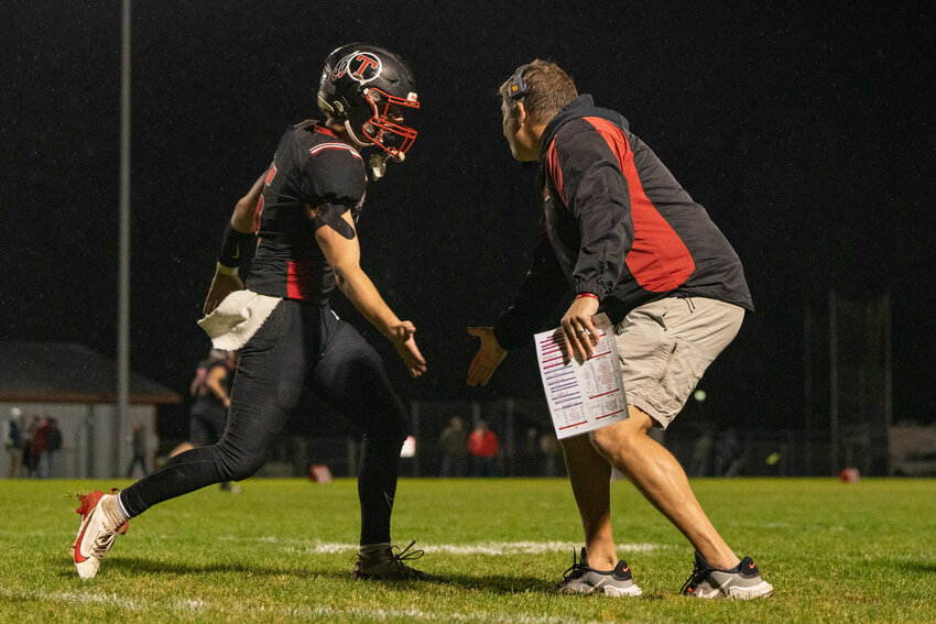 Toledo&rsquo;s Nathan Beaver high fives head coach Mike Christensen during the Riverhawks&rsquo; 43-8 win over Morton-White Pass on Friday, Oct. 18.