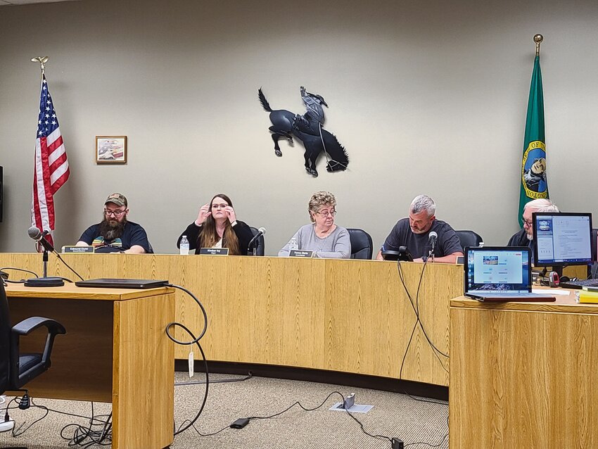 The Roy City Council begins its Oct. 21 business meeting with, from left, Edmund Dunn, Mayor Kimber Ivy, Yvonne Starks, Ryan Muller and William Starks present. Jim Rotondo, not pictured, appeared via phone.