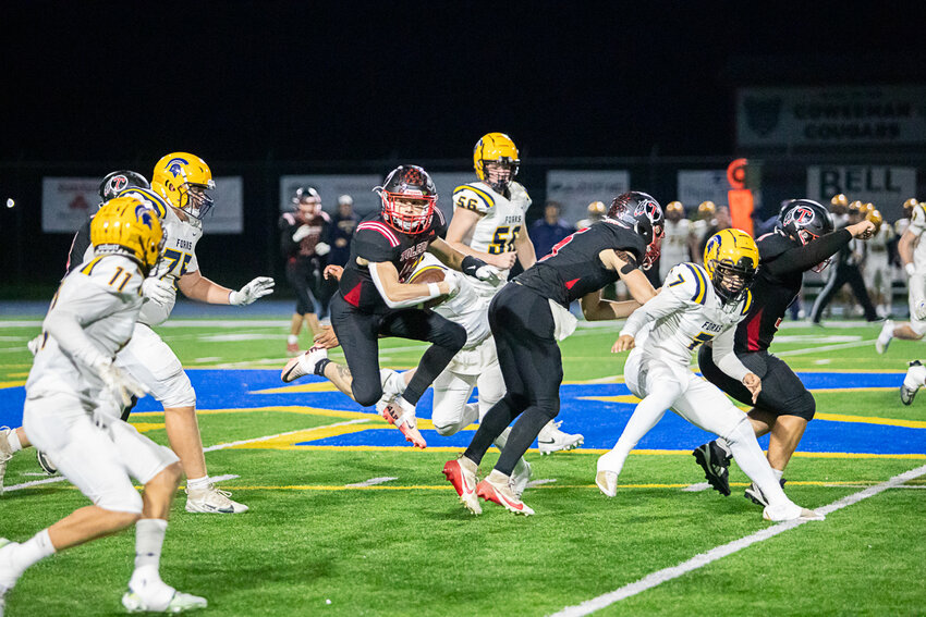 Toledo's Carter Swofford navigates through traffic during Toledo's win over Forks in a 2B crossover in Kelso on Nov. 8.