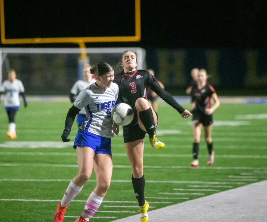 Toledo's Xtyn Norberg battles for possession aginast a Tonasket defender during Toledo's 1-0 loss to Tonasket in a 2B State Round of 16 matchup in Kelso.