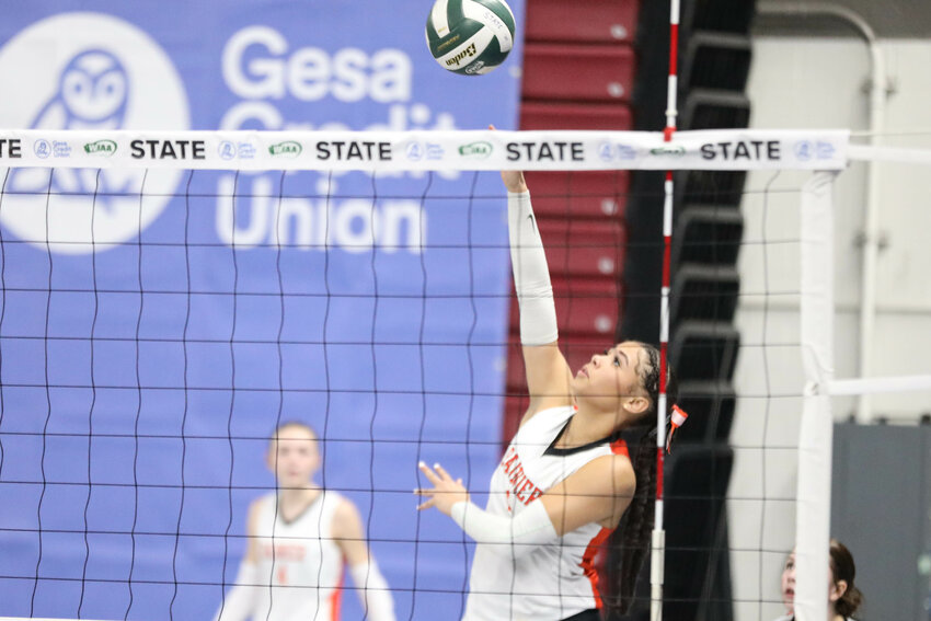 Rainier's Janess Blackburn hits the ball during Rainier's 3-0 loss against Freeman in a 2B state quarterfinal at the Yakima SunDome on Nov. 13.