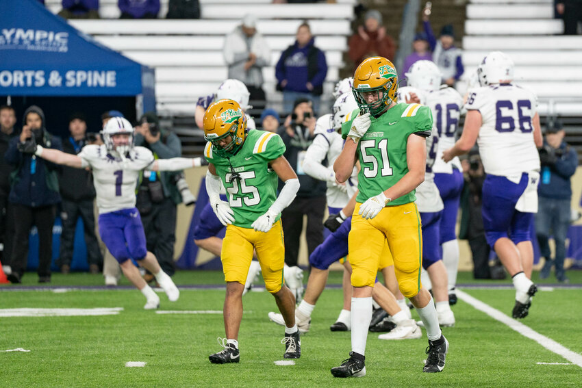 Anacortes players celebrate after a 20-10 2A State Championship win over Tumwater on Saturday, Dec. 7. At Husky Stadium in Seattle.