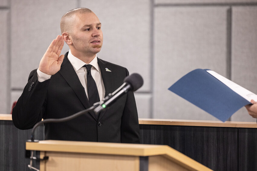 Thurston District 4 Commissioner Wayne Fournier is sworn-in during a ceremony at The Atrium in Olympia on Tuesday, Dec. 17.