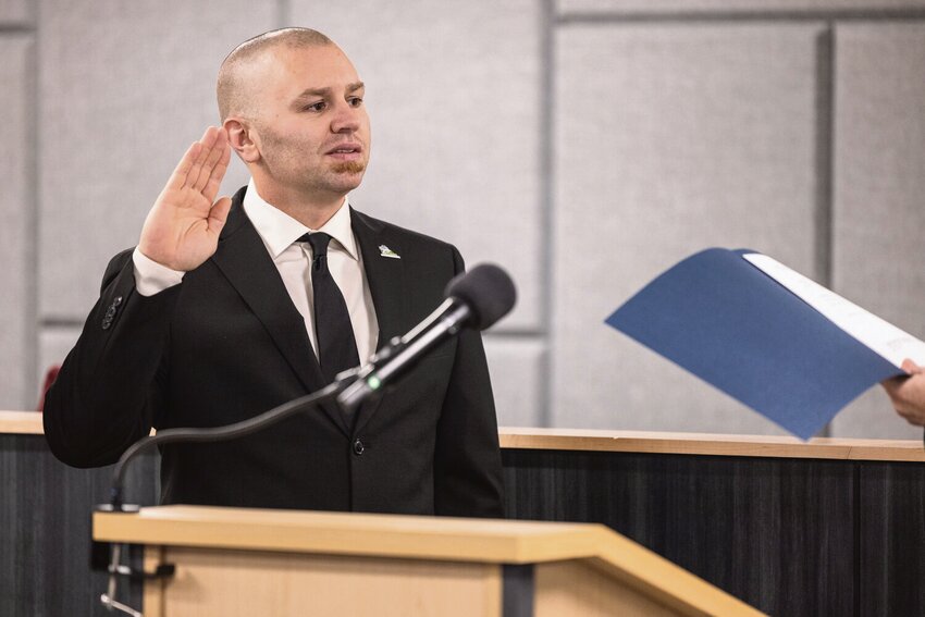 Thurston District 4 Commissioner Wayne Fournier is sworn-in during a ceremony at The Atrium in Olympia on Tuesday, Dec. 17.