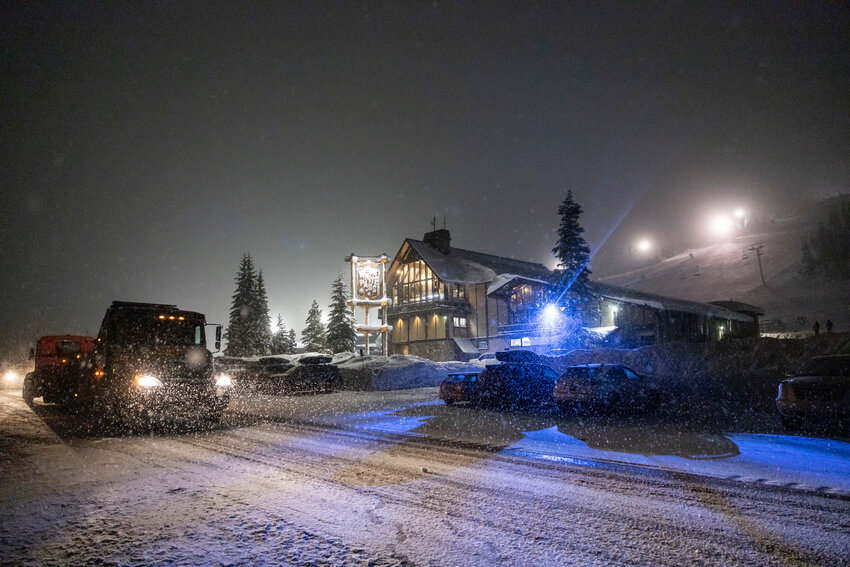 A truck drives by as people celebrate New Year&rsquo;s Eve inside the main lodge at White Pass Ski Area on Tuesday, Dec. 31. The event was called a New York New Year&rsquo;s Eve. Night skiing was  available from 2 to 8 p.m. After that, the ski lodge rang in the new year simultaneously with New York City at 9 p.m. Pacific time with a party featuring DJs from Genesis Entertainment.