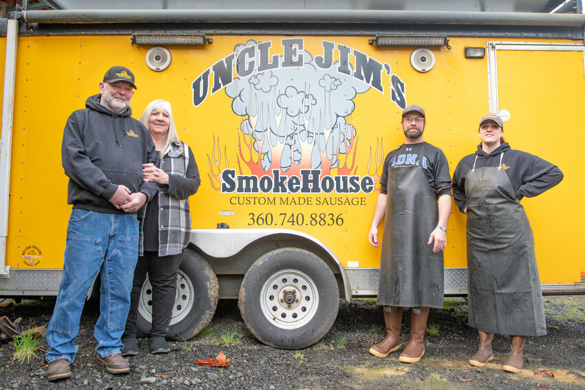 From left, Jim and Cindy Smith smile for a photo along with son, Mark, and Kellie Raschke at Uncle Jim&rsquo;s Smokehouse in Adna on Wednesday, Jan. 8.