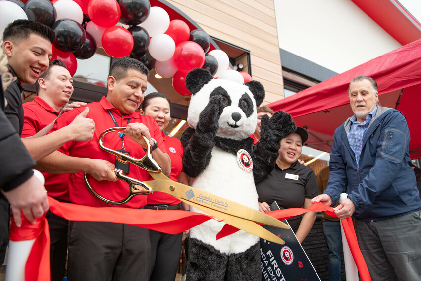 Manager Sam Baltazar cuts the ceremonial Centralia-Chehalis Chamber of Commerce ribbon during the Chehalis Panda Express grand opening on Friday, Jan. 10. The new Panda Express is located at 710 NW Arkansas Way in Chehalis. The Chehalis location&rsquo;s hours are 9:30 a.m. to 10:30 p.m. seven days a week. The drive thru will remain open until 11 p.m.