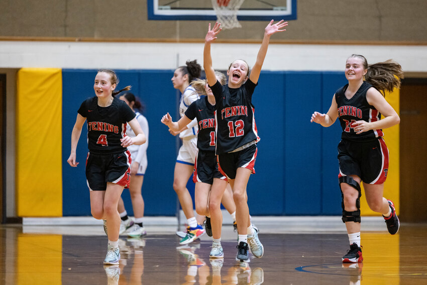 Tenino's Kylie Gonia (12), middle, celebrates winning a girls basketball game against Rochester at Rochester High School on Tuesday, Jan. 14.