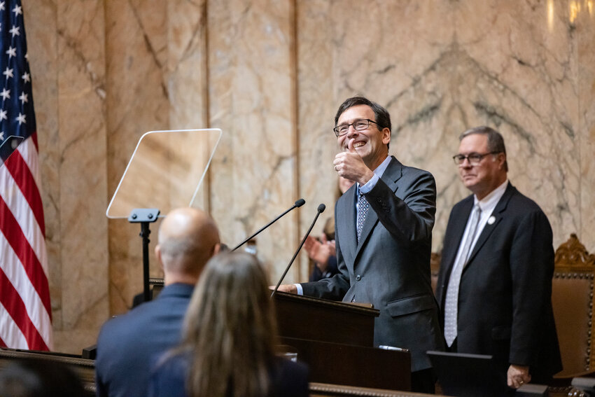 Gov. Bob Ferguson gives a thumbs up to his family during his inaugural address at the Washington State Capitol in Olympia on Wednesday, Jan. 15.