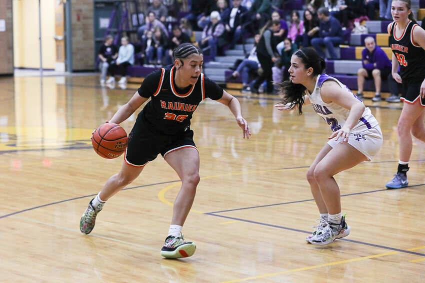 Rainier's Janess Blackburn drives into the paint during Rainier's win at Onalaska on Jan. 15