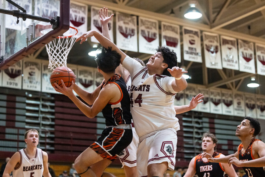 W.F. West&rsquo;s Carlos Vallejo (44) guards Centralia Terrell Sanders during a boys basketball game at W.F. West High School on Wednesday, Jan. 22.