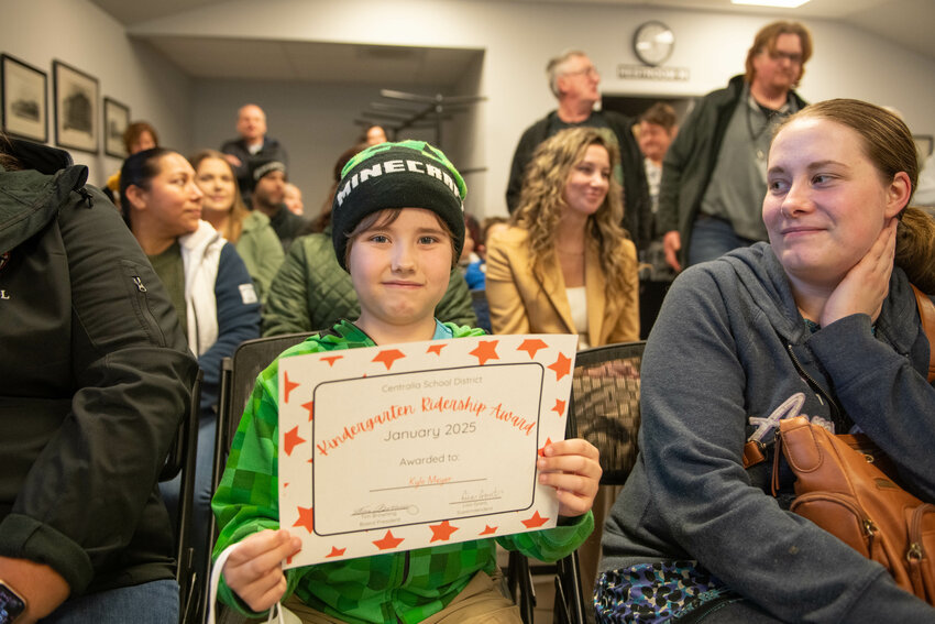 Kylo Meyer receives a kindergarten bus ridership award at a Centralia School Board meeting on Thursday, Jan. 23.