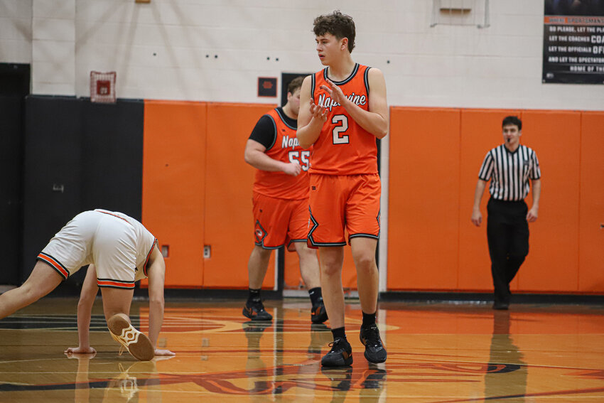 Napavine's Cal Bullock claps after a Rainier turnover on Jan. 25.