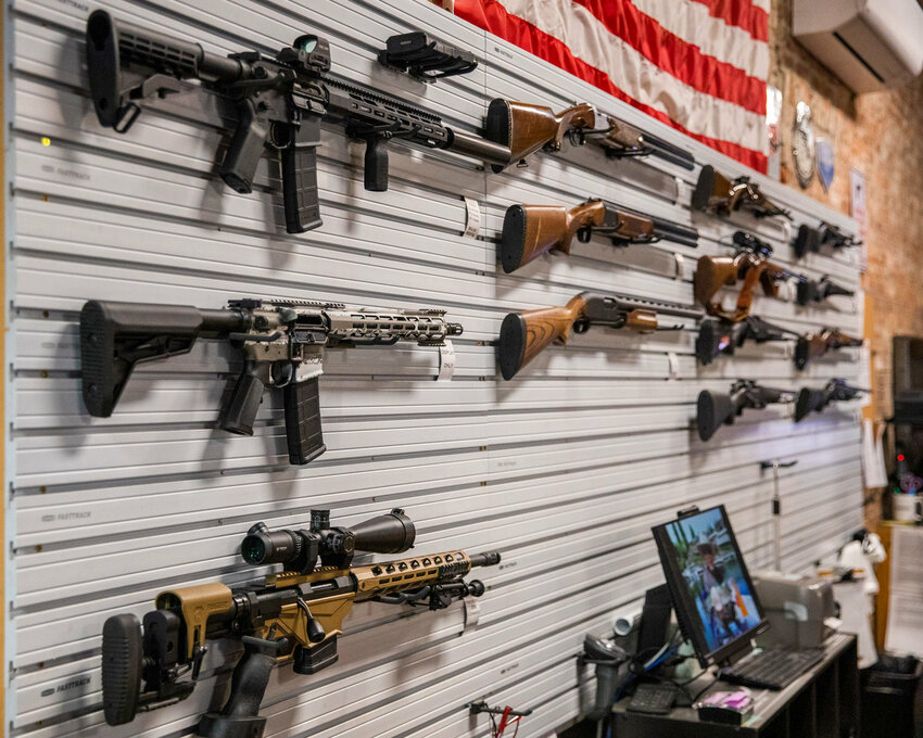 Firearms adorn the walls of The Man Cave Outfitters in Centralia.