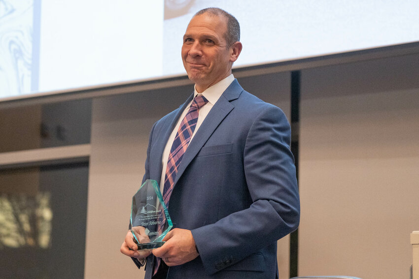 Peter Abbarno smiles after being named the recipient of the 2024 Chamber Evergreen Award during the Centralia-Chehalis Chamber of Commerce annual banquet at Centralia College on Friday, Jan. 24.