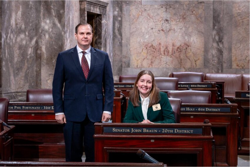 Violet Gorman and Sen. John Braun pose for a photo after she served as a page for the Washington state Senate.
