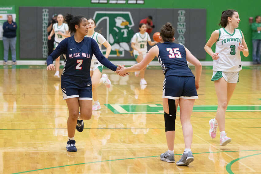 Black Hills' Natalie Buchanan (2) high-fives Kylie McMahon (35) during Black Hills' win over Tumwater on Jan. 31.