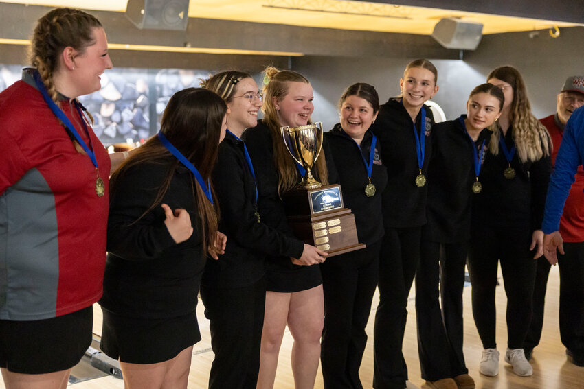 W.F. West bowlers receive a trophy for placing first in the bowling 2A District Tournament at Fairway Lanes in Centralia on Friday, Jan. 31.