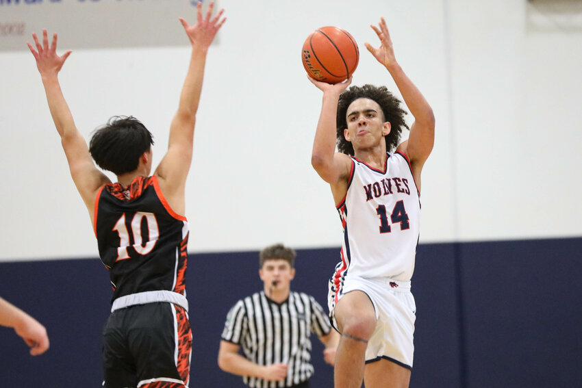 Black Hills' James Morgan shoots a halfcourt shot to end the third quarter against Centralia in an Evergreen Conference game on Wednesday, Feb. 5 at Black Hills High School.