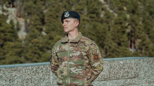 Aaron Flahaut stands during his recent U.S. Air Force reenlistment ceremony at Mount Rushmore.