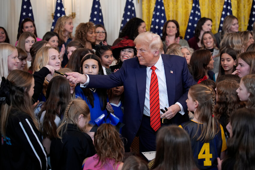U.S. President Donald Trump signs an executive order in the East Room at the White House in Washington, D.C., on Wednesday, Feb. 5, 2025. (Yuri Gripas/Abaca Press/TNS)