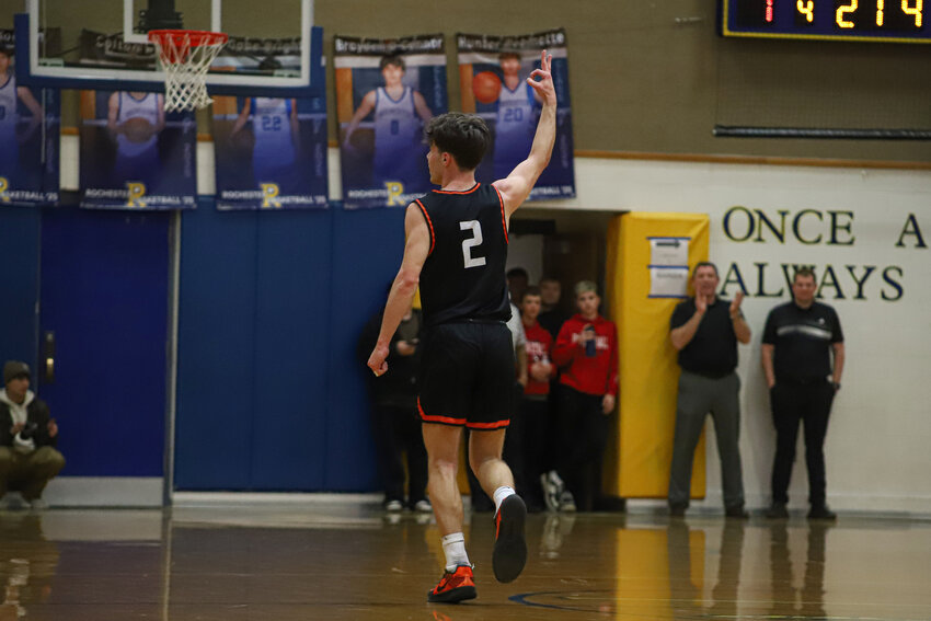Jake Meldrum celebrates a 3-pointer against Forks in a 2B District 4 Tournament quarterfinals game at Rochester High School on Feb. 12.