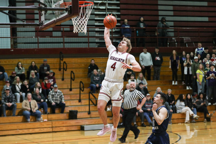 W.F. West's Gage Brumfield leaps to dunk the basketball during W.F. West's 80-67 win over Hockinson in a 2A District 4 Tournament Pigtail on Feb. 12.