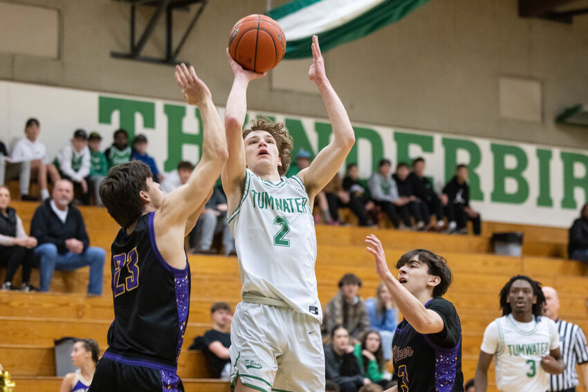 Tumwater's Bryce Morgan (2) shoots the ball during a 2A District 4 Tournament Quarterfinal game against Columbia River at Tumwater High School on Saturday, Feb. 15.
