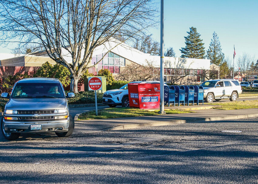 A steady stream of voters dropped off their ballots at the Battle Ground drop box on the afternoon of Tuesday, Feb. 11, during the special election. The first round of election results showed mixed outcomes for local school elections.