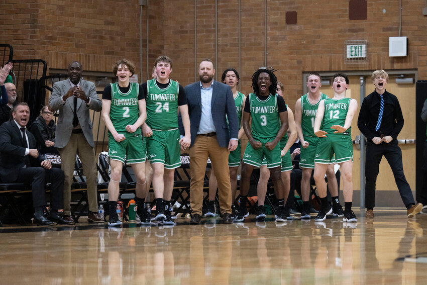Tumwater players and coaches react to a play during a boys 2A District 4 Tournament elimination game against Washougal at Centralia High School on Tuesday, Feb. 18. Tumwater defeated Washougal 54-36.
