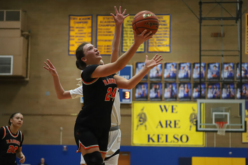 Bryn Beckman races past a defender for a layup against Raymond-South Bend in the 2B District 4 semifinals at Kelso High School on Feb. 18.