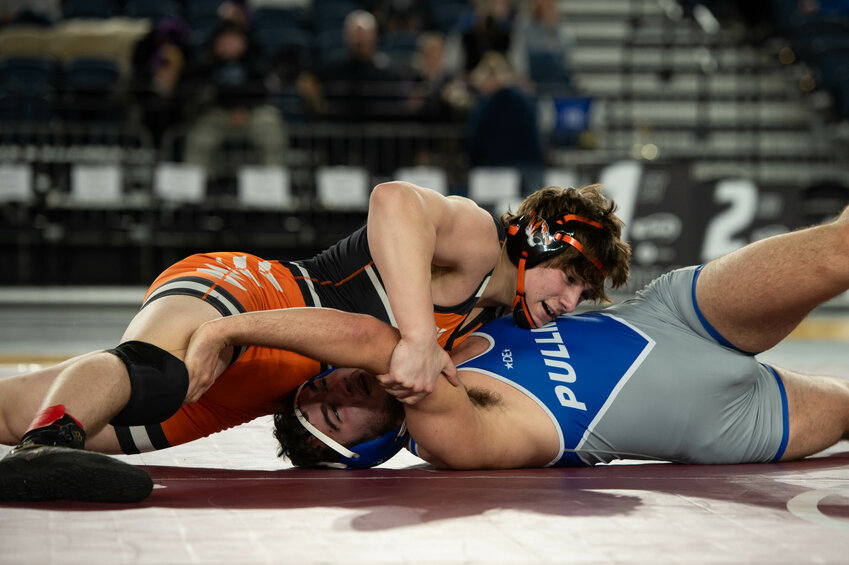 Centralia's Ronin Blair attempts to pin Pullman's Sam Sears in the Class 2A 215-pound third place match at Mat Classic XXXVI on Saturday, Feb. 22 inside the Tacoma Dome.
