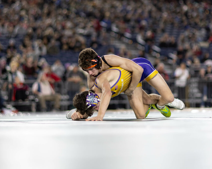 Napavine's Peyton Hernandez wrestles Goldendale's Rydell Myers for third place in the Class 1B/2B 126-pound bracket at Mat Classic XXXVI on Friday, Feb. 21, 2025, inside the Tacoma Dome.