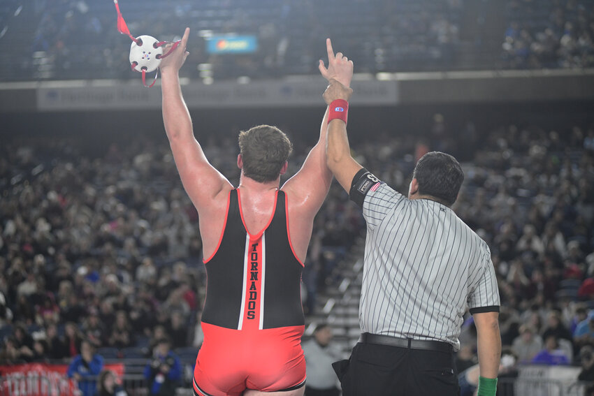 Yelm wrestler Jonah Smith, 285 pounds, celebrates a win inside the Tacoma Dome at WIAAs's Mat Classic on Friday, Feb. 21.