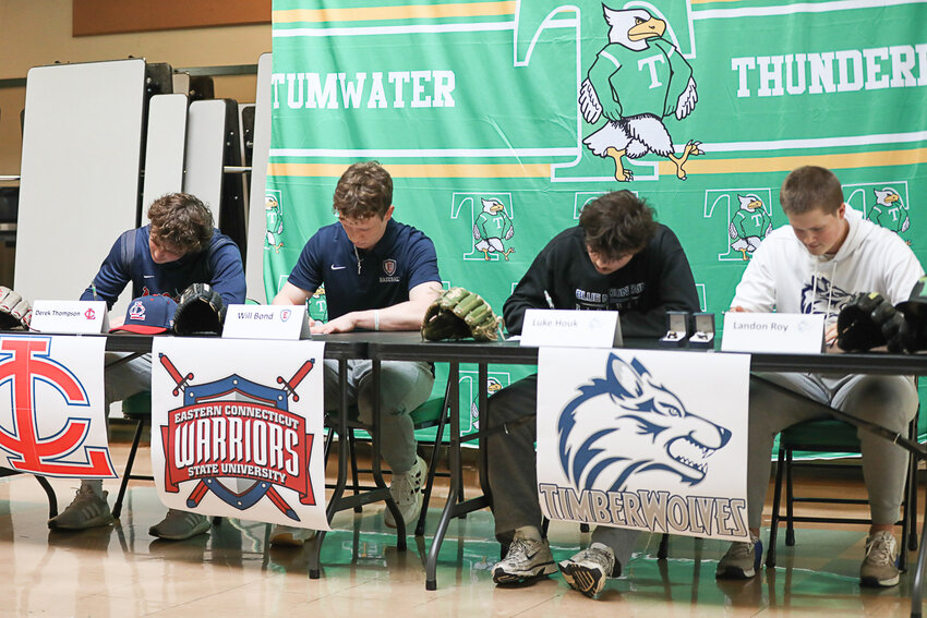 Derek Thompson, Will Bond, Luke Houk, and Landon Roy sign their National Letters of Intent at a signing ceremony at Tumwater High School on Feb. 25.