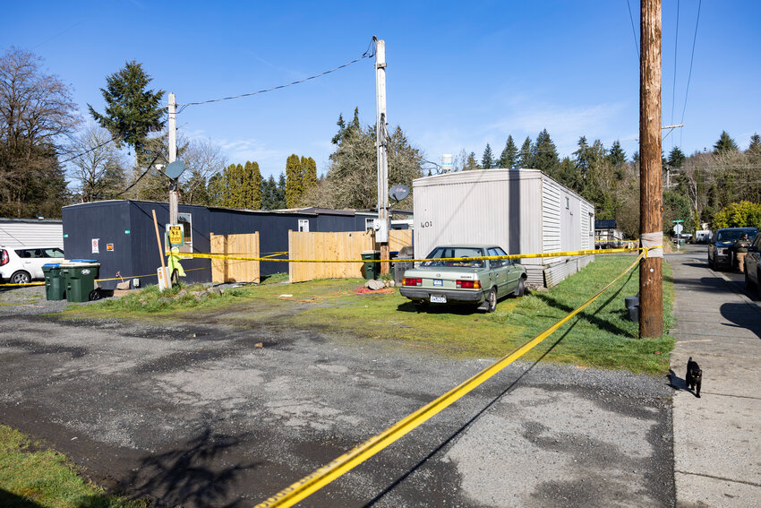 Crime scene tape surrounds a residence after two deceased bodies were found by law enforcement at a residence in Winlock on Wednesday, Feb. 26.