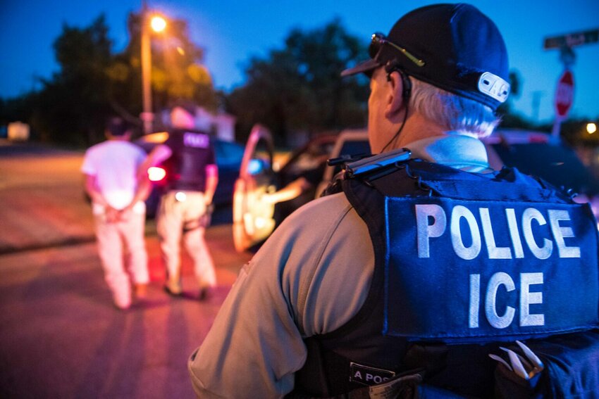 Immigration and Customs Enforcement agents arrest a fugitive in 2020.