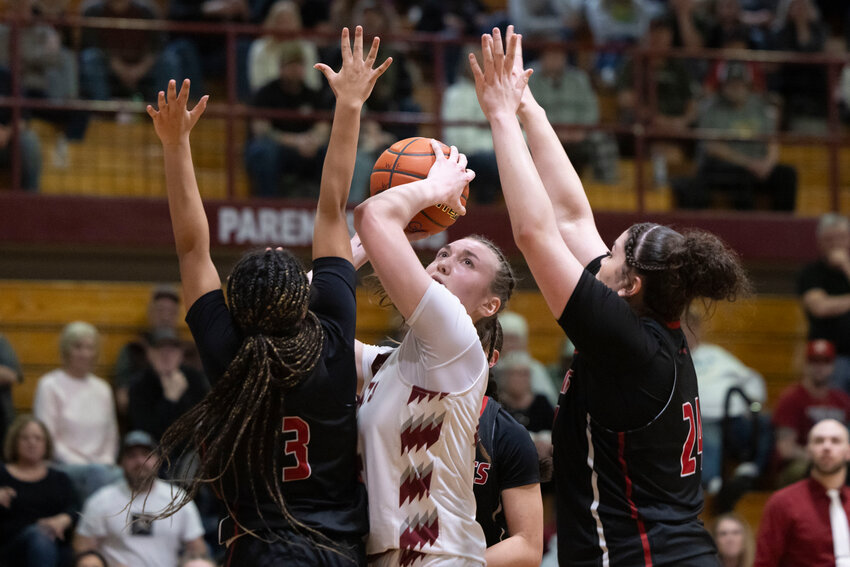 Archbishop Murphy&rsquo;s Kayla Hoofkin (3) and Celine Wright (24) guard W.F. West's Julia Dalan (44) during a 2A Girls State Opening Round game at W.F. West High School on Saturday, March 1.