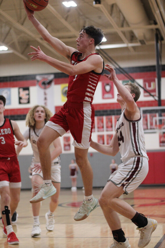 Toledo's Adam Kruger goes up for a layup during Toledo's loss to Reardan in a 2B Regional Round Matchup at Cheney High School on March 1.