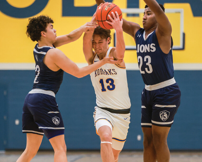 Columbia Adventist Academy&rsquo;s Caleb Payne splits the Sound Christian Lion defense while driving to the hoop during the Kodiaks&rsquo; 61-50 first round loss on Tuesday, Feb. 25.