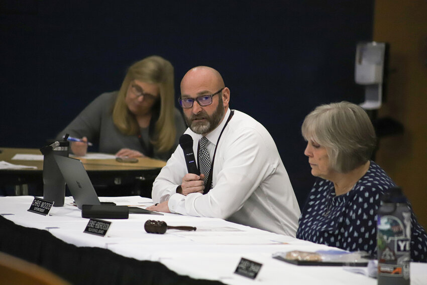 Yelm Community Schools Superintendent Chris Woods provides updates to the Board of Directors at a board meeting at Yelm Middle School on Feb. 13.