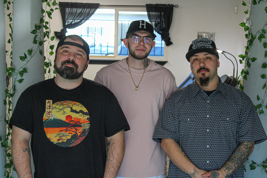 From left, Terry Gunter, Jacob Rodstrom and Steven Gamez pose for a photo at Acropolis Tattoo on Feb. 27.